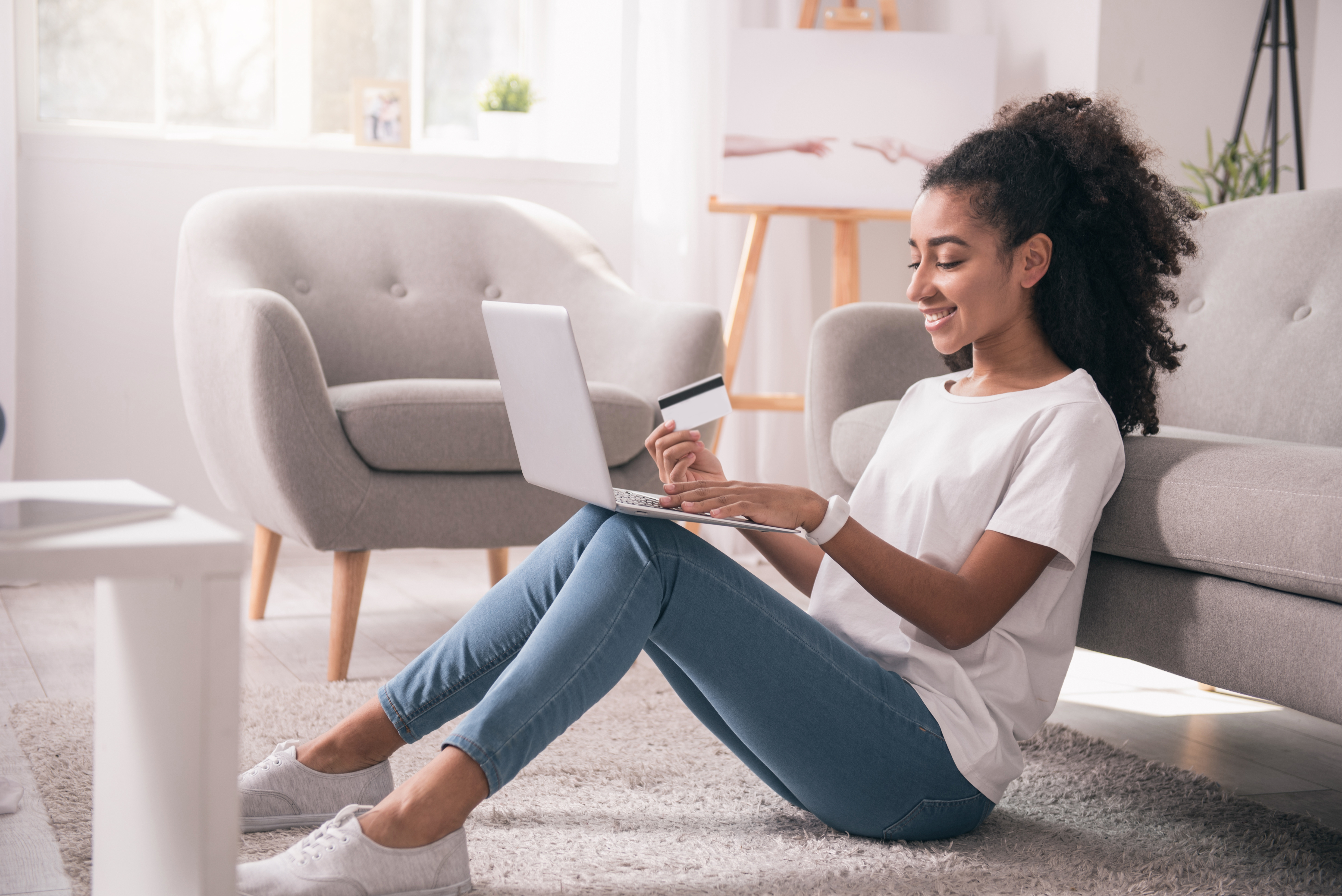 A woman uses online banking to pay her bills.