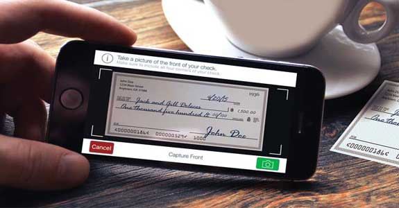 A person using mobile deposit to deposit a check on her credit union account