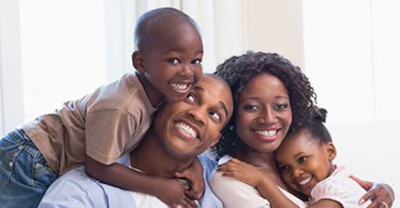 family smiling about new mortgage loan