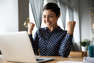 A happy woman checks her money market account balance.