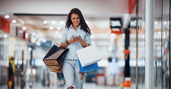 A woman enjoys shopping and collecting credit card rewards.